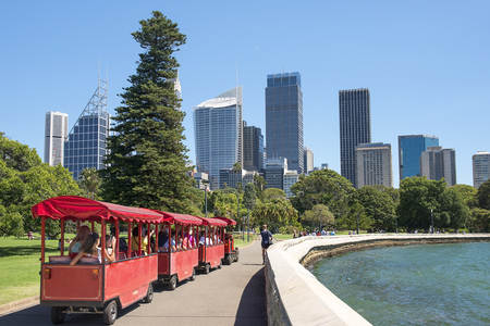 Sydney, Australia - March 11, 2018: children's train on the Sydney waterfront in the background of skyscrapers of Sydney central business district ( CBD )のeditorial素材