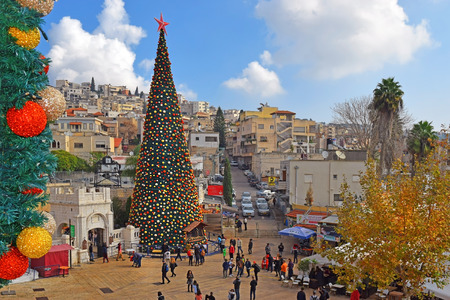 NAZARETH, ISRAEL - DECEMBER 23: People celebrate the Christmas, near the Greek Orthodox Church of the Annunciation in Nazareth, Israel, december 21, 2018のeditorial素材