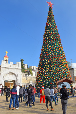 NAZARETH, ISRAEL - DECEMBER 23: People celebrate the Christmas, near the Greek Orthodox Church of the Annunciation in Nazareth, Israel, december 21, 2018のeditorial素材