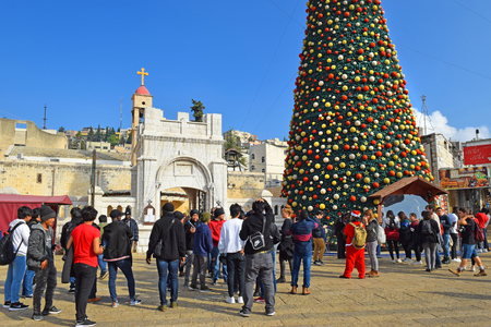 NAZARETH, ISRAEL - DECEMBER 23: People celebrate the Christmas, near the Greek Orthodox Church of the Annunciation in Nazareth, Israel, december 21, 2018のeditorial素材