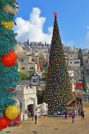 NAZARETH, ISRAEL - DECEMBER 23: People celebrate the Christmas, near the Greek Orthodox Church of the Annunciation in Nazareth, Israel, december 21, 2018のeditorial素材
