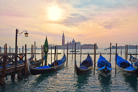 gondolas moored on the Grand Canal in Venice on the background basilica San Giorgio Maggiore, Italyの写真素材