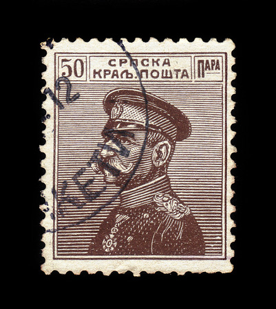 SERBIA - CIRCA 1911: A stamp printed in Serbia, shows portrait of the first King of Serbs, Croats and Slovenes Peter I Karadjordjevic (1844 - 1921), dark brown, circa 1911のeditorial素材