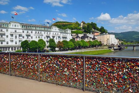 padlocks as a symbol of everlasting love at a Makartsteg bridge ( Bridge of Love ) over the river Salzach in Salzburg (Austria)のeditorial素材