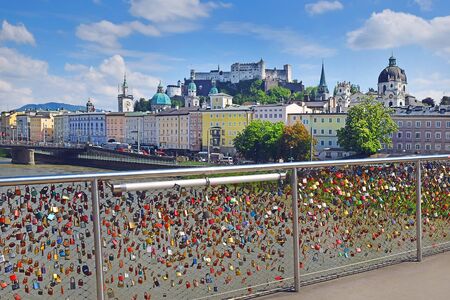 padlocks as a symbol of everlasting love at a Makartsteg bridge ( Bridge of Love ) over the river Salzach in Salzburg (Austria)のeditorial素材