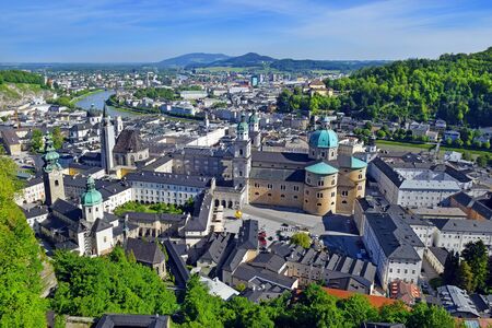 panoramic view of the historic city of Salzburg with beautiful Salzach river and Salzburg Cathedral from famous Hohensalzburg Fortress, Salzburger Land, Austriaの写真素材