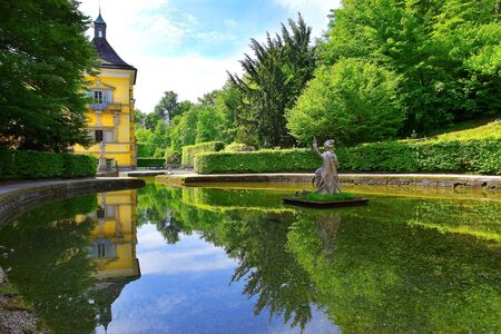 Salzburg, Austria - May 25, 2019 : sculptures at the pond in Public Gardens of Hellbrunn Palace (Schloss Hellbrunn) in Salzburgのeditorial素材
