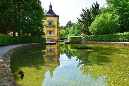 Salzburg, Austria - May 25, 2019 : sculptures at the pond in Public Gardens of Hellbrunn Palace (Schloss Hellbrunn) in Salzburgのeditorial素材