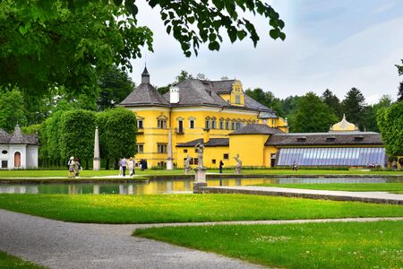 Salzburg, Austria - May 25, 2019 : Hellbrunn Palace (Schloss Hellbrunn), summer residence of the Archbishop of Salzburg, the view from the side of the greenhouseのeditorial素材
