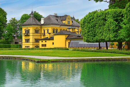 Salzburg, Austria - May 25, 2019 : Hellbrunn Palace (Schloss Hellbrunn), summer residence of the Archbishop of Salzburg, the view from the side of the greenhouseのeditorial素材