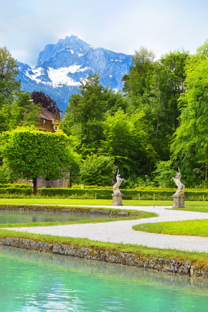 Salzburg, Austria - May 25, 2019 : sculptures of a unicorn in the park on the background of the Mount Helbrunn, Hellbrunn Palace - summer residence of the Archbishop of Salzburgのeditorial素材