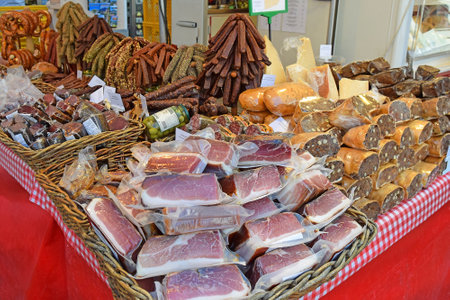 Salzburg, Austria - May 24, 2019: all kinds of meat products at a stand at street food open market - Salzburger Brezen in Salzburgのeditorial素材
