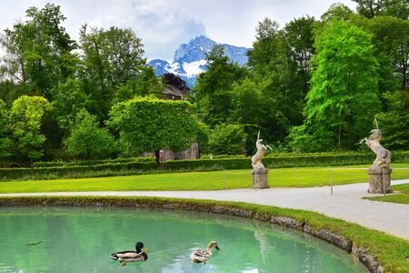 Salzburg, Austria - May 25, 2019 : sculptures of a unicorn in the park on the background of the Mount Helbrunn, Hellbrunn Palace - summer residence of the Archbishop of Salzburgのeditorial素材