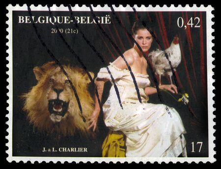 Belgium - CIRCA 2000: A stamp printed in Belgium shows a painting by J. Charlier is a belgian artist, allegorical image of Belgium with the symbols of its three regions: the lion, iris and rooster, circa 2000のeditorial素材