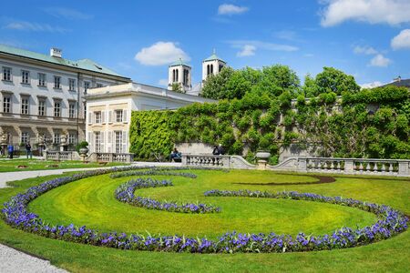 Salzburg, Austria - May 23, 2018 : magnificent landscaped park - Mirabell gardens and Mirabell Palace or Schloss Mirabell in Salzburgのeditorial素材
