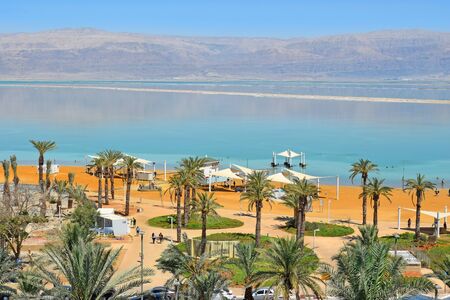 Dead Sea, Ein Bokek, Israel - July 14, 2019 : vacationers and tourists bathe in the Dead Sea, public beach at the resort Ein Bokekのeditorial素材