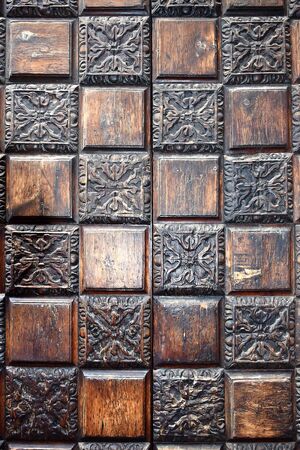 very old wood carved panel with pattern, handworkの写真素材