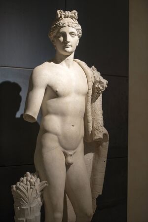 antique statue of young man, ancient greek godの写真素材