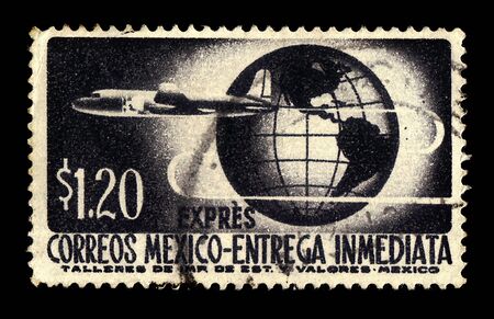 MEXICO - CIRCA 1962: a stamp printed in the Mexico shows airplane on the background of the globe, circa 1962のeditorial素材