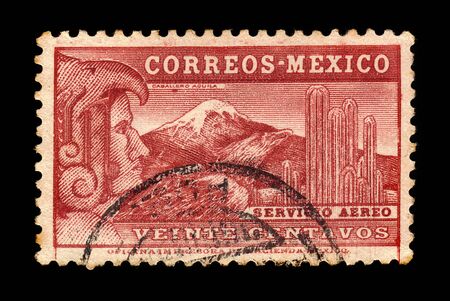 MEXICO - CIRCA 1935: a stamp printed in the Mexico shows Aztec Eagle Man, giant cactus Saguaro (Carnegiea gigantea) and the volcano Popocatepetl, circa 1935のeditorial素材