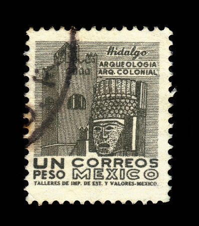 MEXICO - CIRCA 1950: a stamp printed in the Mexico shows head of Toltec warrior, carved in stone, Tula, Mexico, circa 1950のeditorial素材
