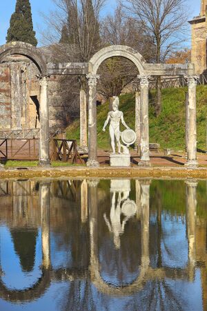 ancient pool called Canopus, surrounded by greek sculptures in Villa Adriana (Hadrian's Villa) and reflections in water in Tivoli, Italyの写真素材