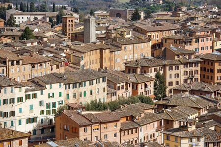 aerial view over roofs of the Siena, medieval town, capital of the province of Siena in Tuscany, Italyの写真素材