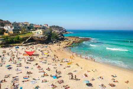 Sydney, Australia - March 30, 2019: many people sunbathe and swim in the Pacific Ocean on the famous Bondi beach, Sydney, New South Wales, Australiaのeditorial素材