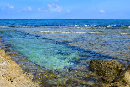 Hof Dor - Beach Nature Reserve, picturesque beach, a coastal strip with more bays and inlets and ruins of the ancient port are visible under the water, northern Israelの写真素材