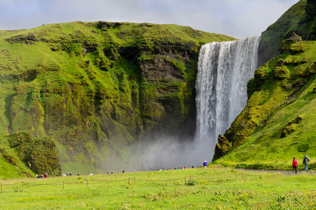 beautiful scenery of the majestic Skogafoss waterfall, located on the south coast of Icelandの写真素材