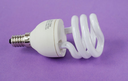 Small power saving up lamp on violet background