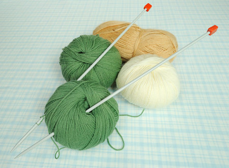 Colorful knitting yarn with spokes on a cloth