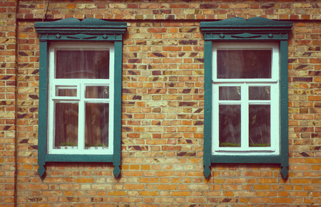 Old vintage wooden window on the wallの写真素材