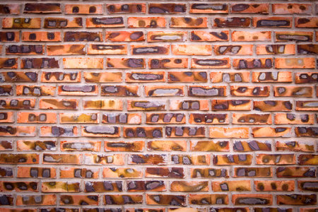 Old brick wall texture background, colorful and cracked