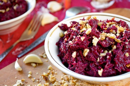 Fresh beet salad with garlic and walnuts.の写真素材