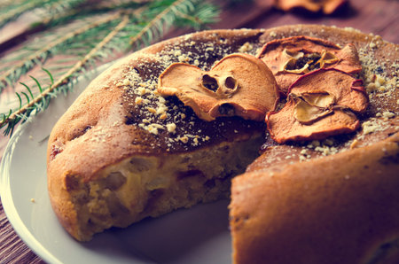 Apple cake with dry fruits, Christmas decoration. Selective focus