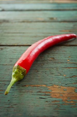 chilli pepper on wooden background. Selective focus.の写真素材