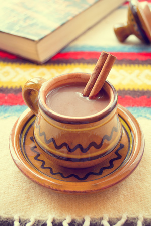 Hot chocolate with cinnamon in a rustic ware. Christmas decoration.の写真素材