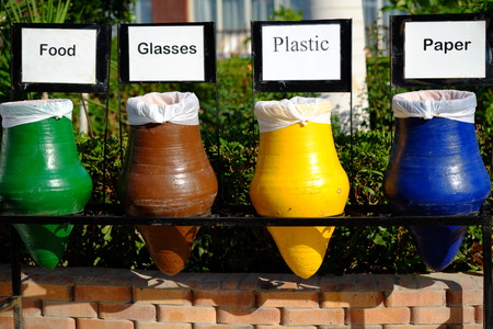 Colorful ceramic pots for separate garbage, collection of recycle materialsの写真素材