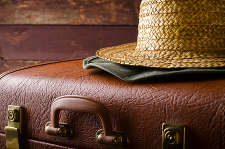 Old vintage, retro suitcase and hats on dark background. Travel conceptの写真素材
