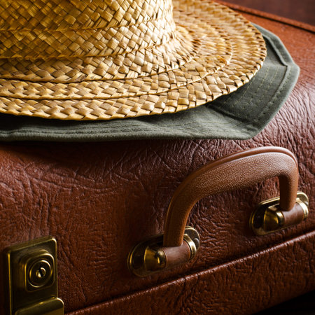 Old vintage, retro suitcase and hats on dark background. Travel conceptの写真素材