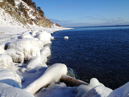 Sunny day at the lake "Baikal" in a winter dayの写真素材