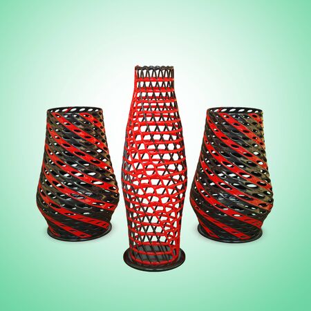 Three decorative black vases with a red stripe on a green background. 3D rendering.の写真素材