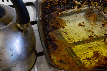 Dirty gas stove. Stove after cooking. A mess in the kitchen.の写真素材
