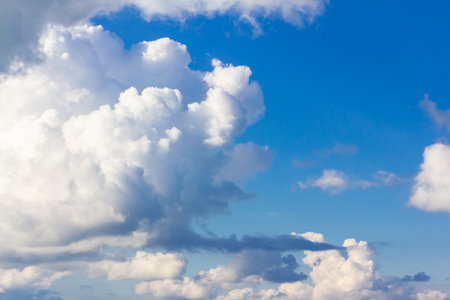 Blue sky background with clouds. Clouds on a clear day.の写真素材