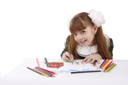 Girl is painting her family in bright colours. Schoolgirl is  drawing  in pencil. Isolated over white background.の写真素材