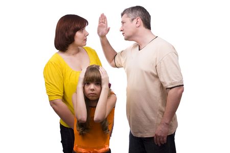 Husband is striking wife.  Parents swear, and children suffer. Girl suffers while parents argue vehemently in white background.  Couple fightingの写真素材