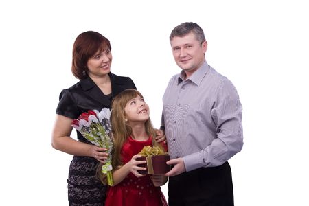 Happy family. Father is giving gifts daughter and mother. Man say happy birthday to girl and woman on white background.の写真素材