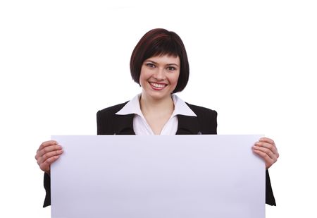 Portrait of a happy businesswoman holding white blank card against isolated white background. A beautiful young woman is holding a blank white sign. Business woman standing beside a billboardの写真素材
