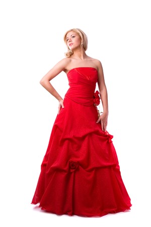 Beautiful young woman in red long dress . Girl in red dress full-length. 
Happy woman in red prom dress.
の写真素材
